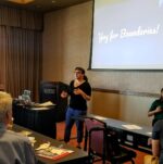 Molly Adler presenting at a conference with "boundaries" on screen behind her.