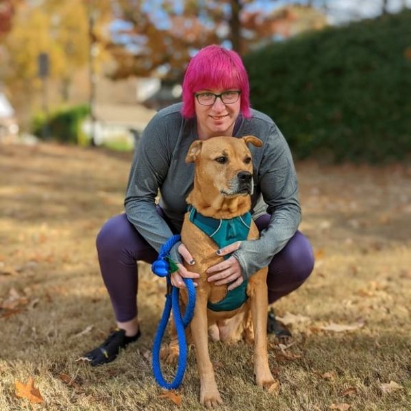 Coach Keira with their dog